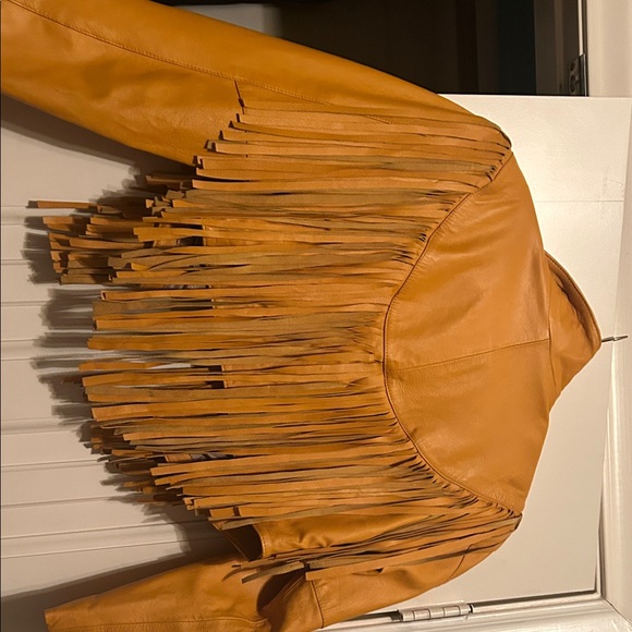More of a golden yellow, real leather jacket with fringe. - Picture 2 of 2